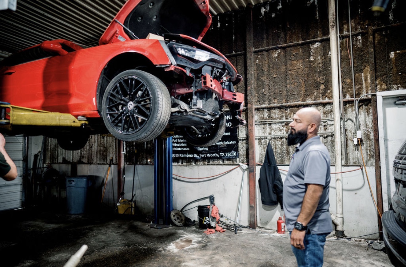 Collision repair on a red vehicle at Ollin Automotive